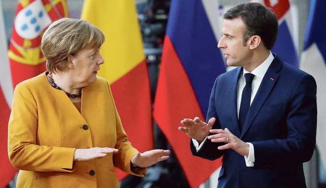 Angela Merkel et Emmanuel Macron, vendredi à Bruxelles. © Yves Herman/Reuters